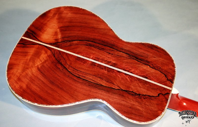 Ebony fretboard, doubl bound Brazilian rosewood headplate, ebony 